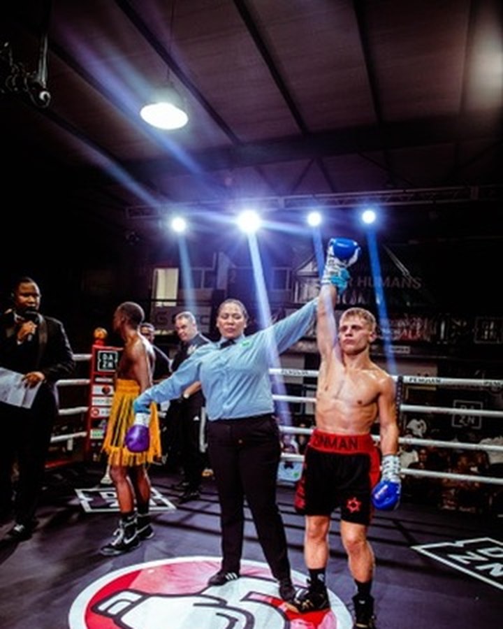 Doron's hand raised by the referee after a pro win