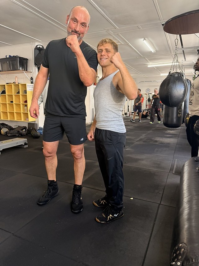 Doron with a client beside the heavy bags after a private boxing session